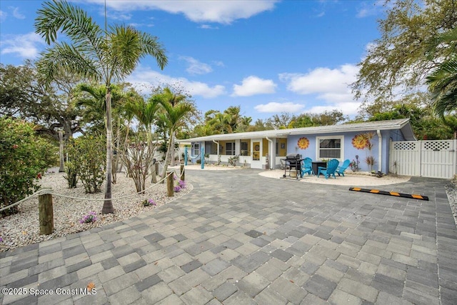 rear view of property with a patio area