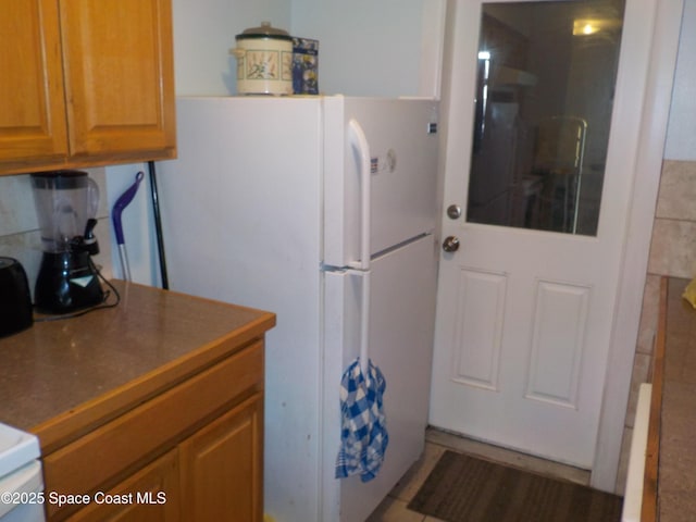 kitchen featuring white fridge