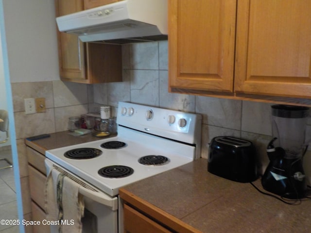 kitchen with tile walls, backsplash, and white electric range oven