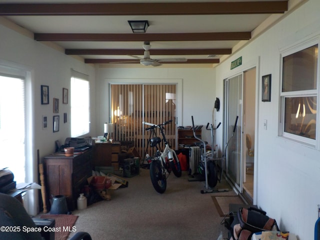 interior space featuring ceiling fan and beamed ceiling