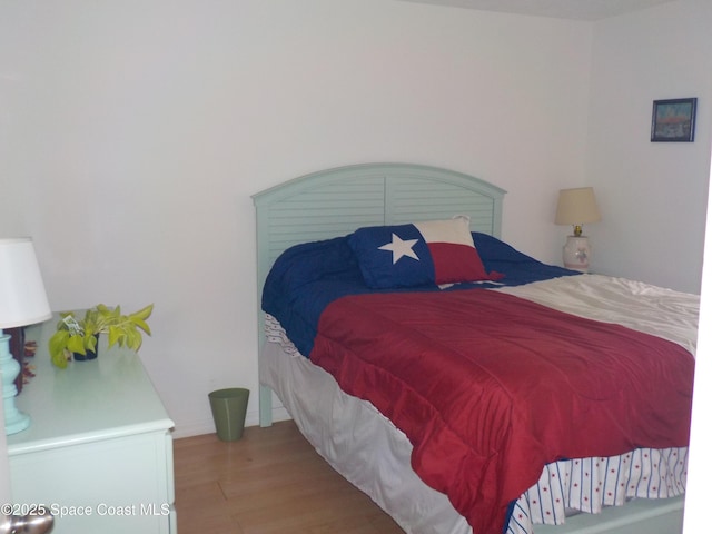 bedroom featuring light wood-type flooring