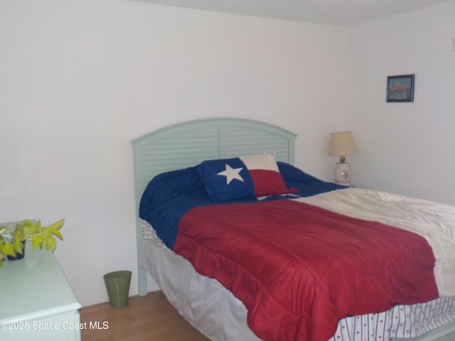 bedroom featuring hardwood / wood-style flooring