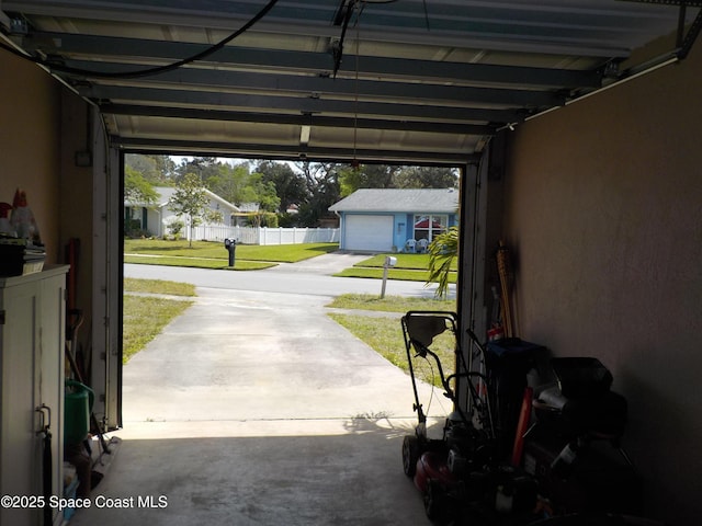 garage featuring a lawn