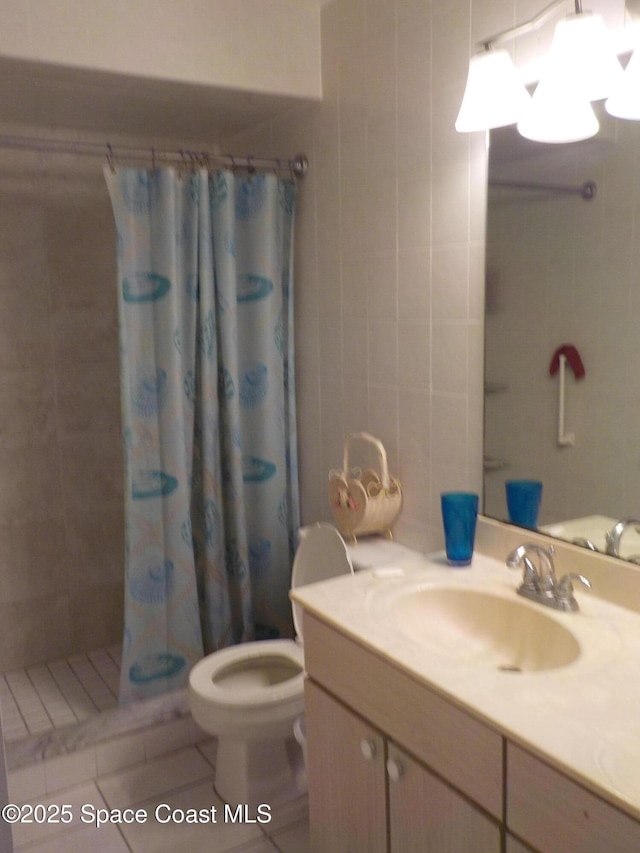 bathroom with toilet, a shower with curtain, tile walls, vanity, and tile patterned flooring