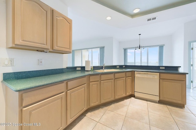 kitchen with visible vents, dishwasher, dark countertops, a sink, and recessed lighting