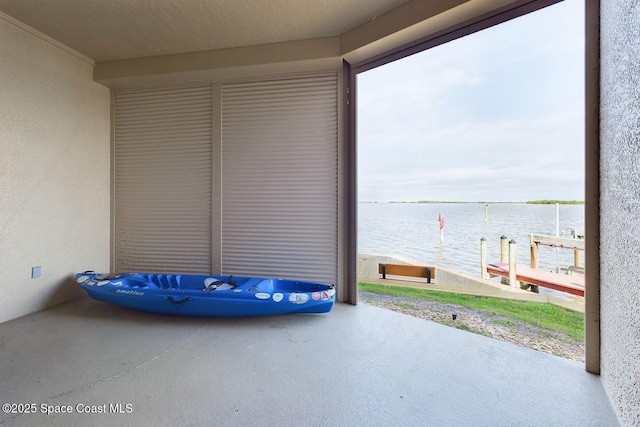 view of patio with a water view