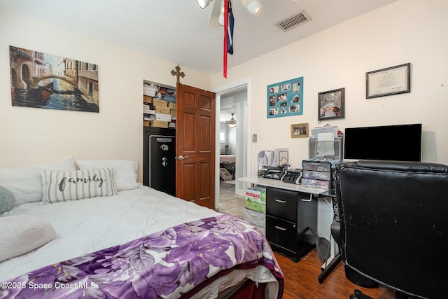 230 Andros Dr, Merritt Island, FL 32952 - bedroom with ceiling fan, wood-type flooring, and a textured ceiling