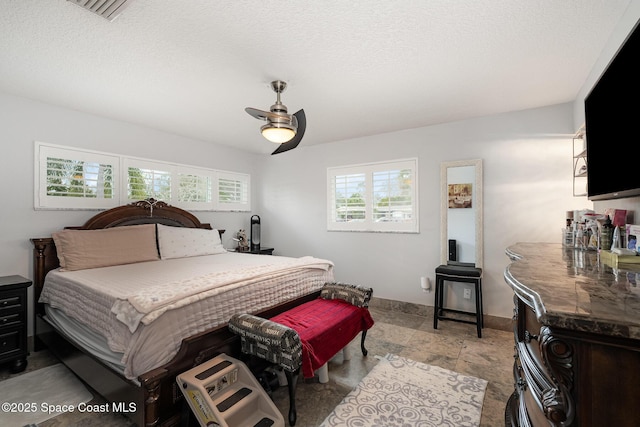 230 Andros Dr, Merritt Island, FL 32952 - bedroom with ceiling fan and a textured ceiling