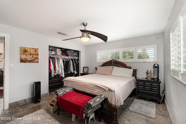 230 Andros Dr, Merritt Island, FL 32952 - bedroom with ceiling fan, a closet, and a textured ceiling