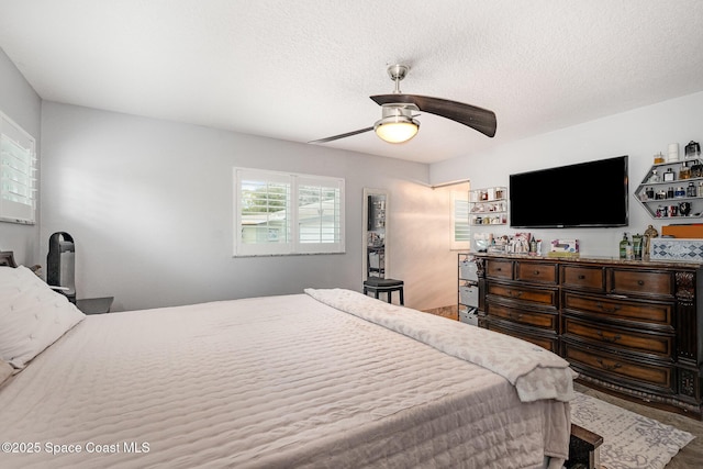 230 Andros Dr, Merritt Island, FL 32952 - bedroom with ceiling fan and a textured ceiling
