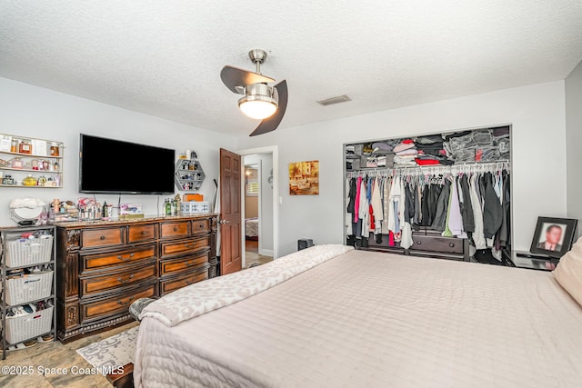 230 Andros Dr, Merritt Island, FL 32952 - bedroom featuring ceiling fan, a textured ceiling, and a closet