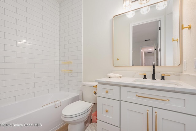 full bathroom with vanity, tiled shower / bath combo, and toilet