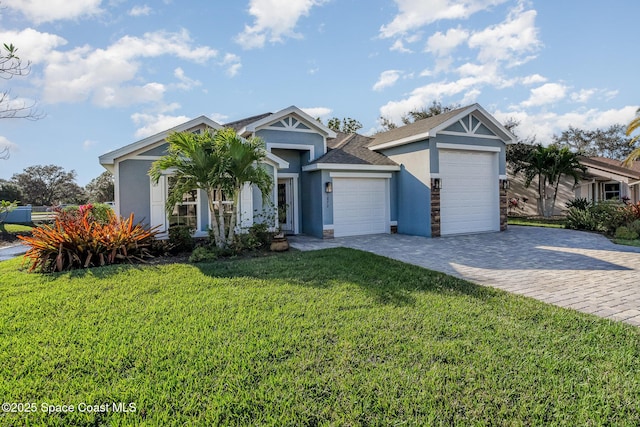 view of front of home featuring a garage and a front lawn