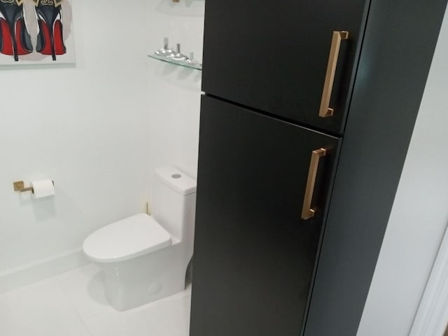 bathroom featuring tile patterned flooring and toilet