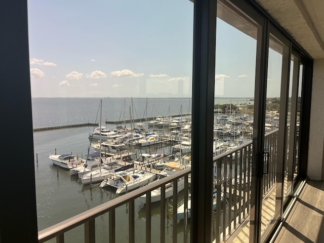 balcony featuring a water view