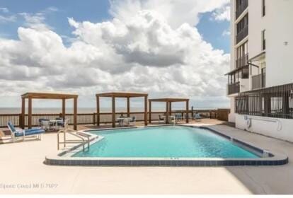 view of swimming pool with a patio