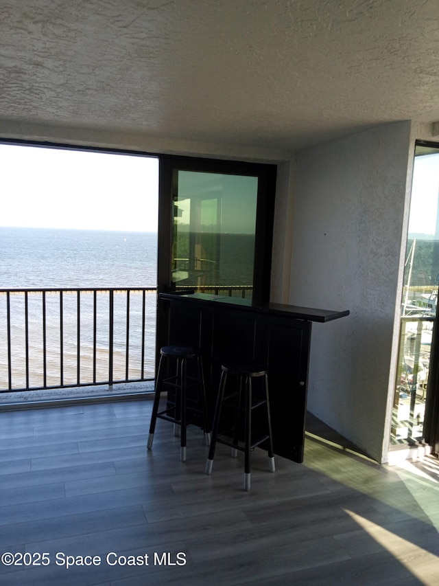 balcony featuring a water view