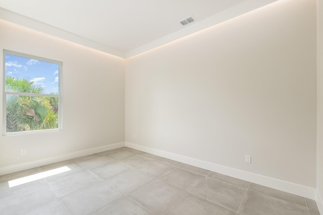 empty room with light tile patterned floors