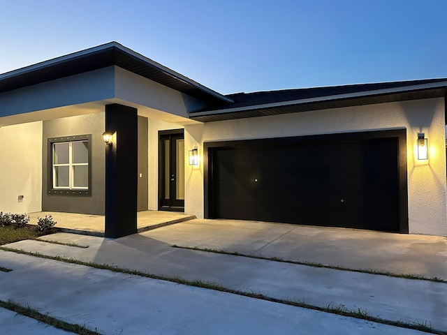 view of front of property with a garage