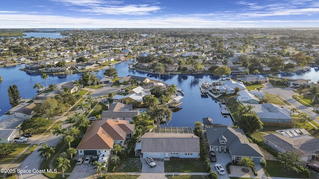 aerial view featuring a residential view and a water view