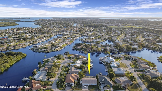 bird's eye view featuring a water view and a residential view