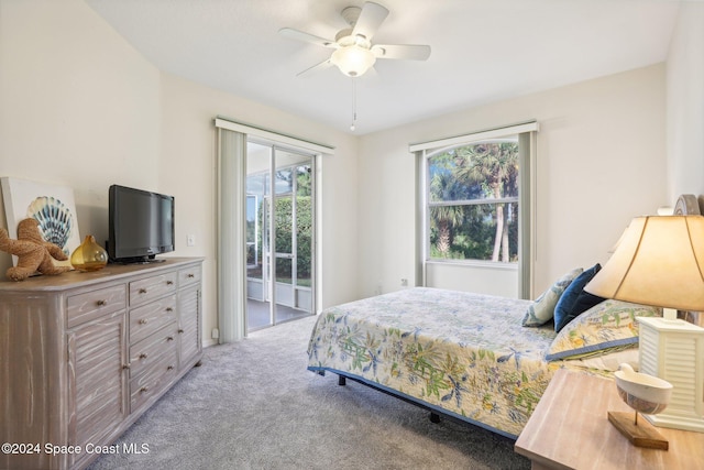 bedroom with ceiling fan, light carpet, and access to outside