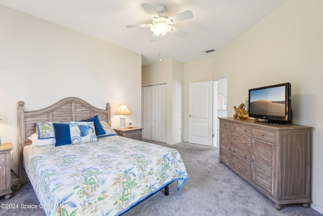 bedroom with a ceiling fan, a closet, light carpet, and visible vents