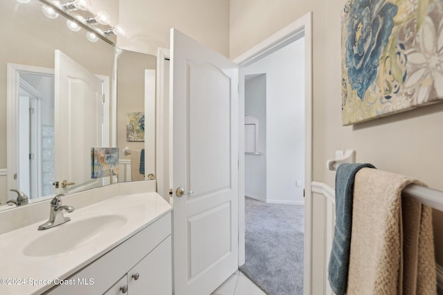 bathroom with vanity and baseboards