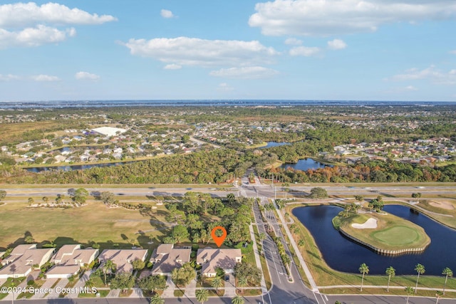 drone / aerial view featuring a residential view and a water view