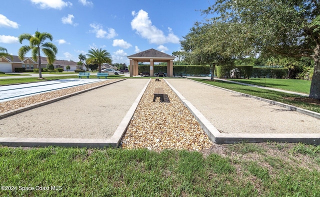 view of property's community with a gazebo, a yard, and a residential view