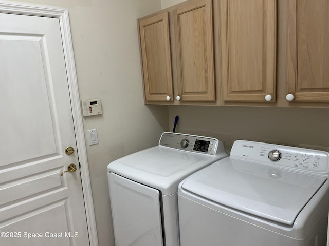 184 Tramore Pl, Melbourne Beach, FL 32951 - laundry room with cabinet space and independent washer and dryer
