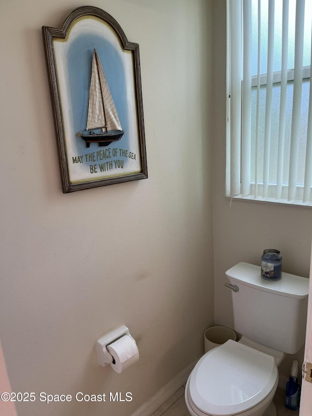 184 Tramore Pl, Melbourne Beach, FL 32951 - bathroom featuring baseboards and toilet
