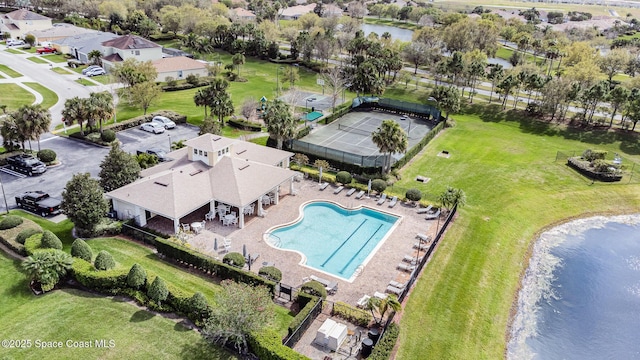 birds eye view of property with a water view