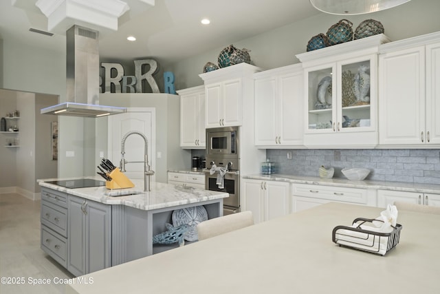 4955 Dixie Hwy NE Unit 801, Palm Bay, FL 32905 - kitchen featuring backsplash, stainless steel appliances, extractor fan, and white cabinets