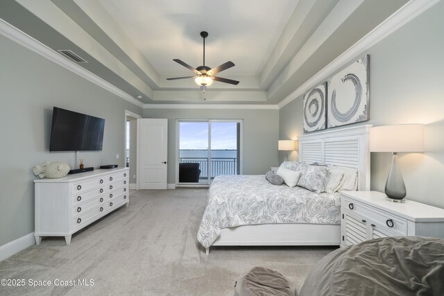 4955 Dixie Hwy NE Unit 801, Palm Bay, FL 32905 - bedroom with visible vents, crown molding, a raised ceiling, light colored carpet, and access to exterior