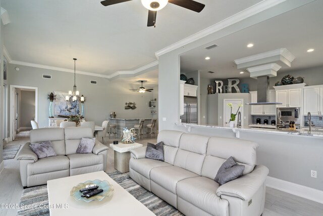4955 Dixie Hwy NE Unit 801, Palm Bay, FL 32905 - living area featuring crown molding, recessed lighting, and visible vents
