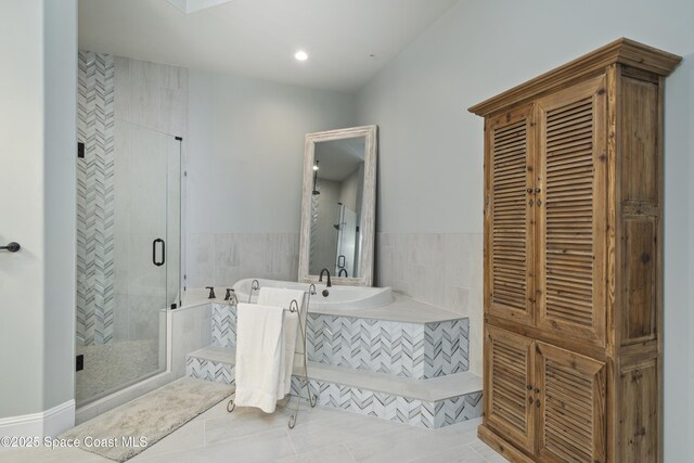 4955 Dixie Hwy NE Unit 801, Palm Bay, FL 32905 - full bathroom with tile patterned flooring, a garden tub, and a stall shower