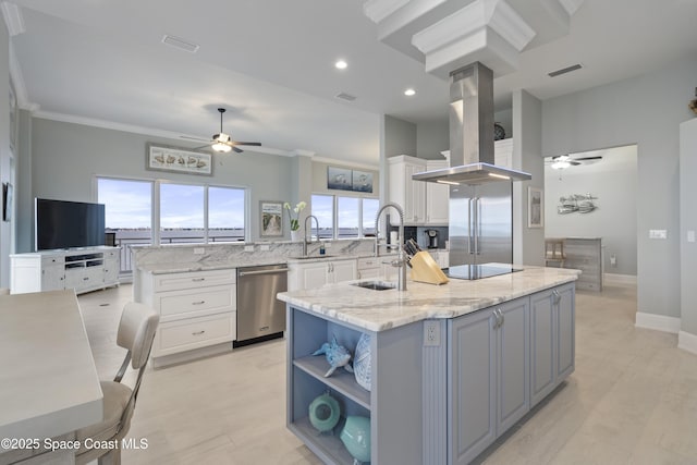 4955 Dixie Hwy NE Unit 801, Palm Bay, FL 32905 - kitchen with white cabinets, appliances with stainless steel finishes, island exhaust hood, and a sink