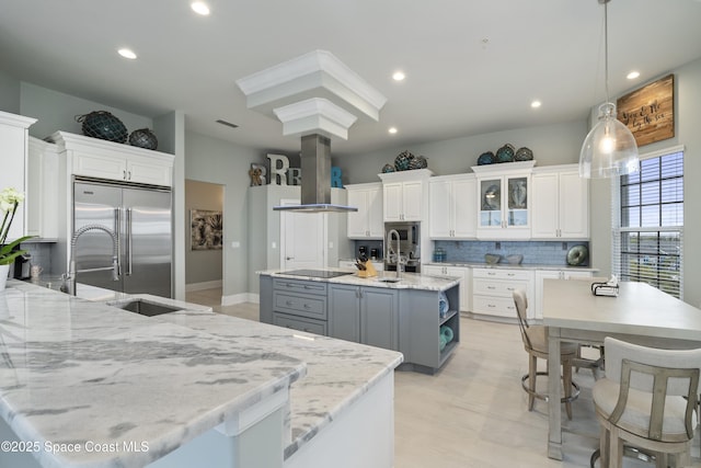 4955 Dixie Hwy NE Unit 801, Palm Bay, FL 32905 - kitchen with stainless steel built in fridge, a center island with sink, gray cabinets, island exhaust hood, and decorative backsplash