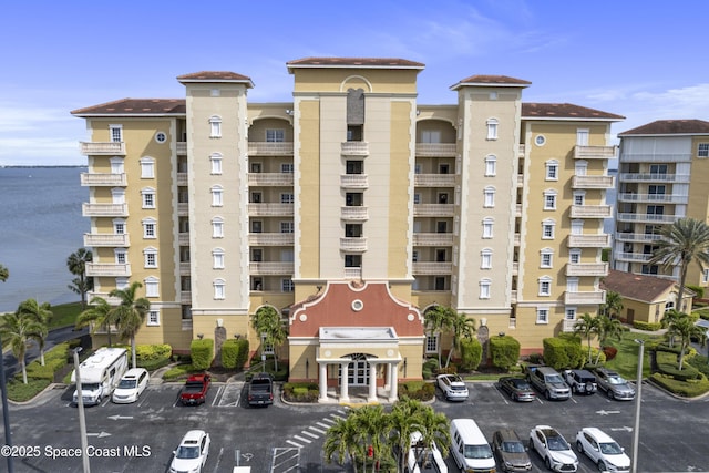 view of property featuring uncovered parking