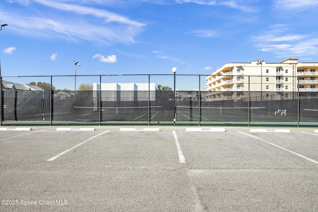 view of sport court with fence