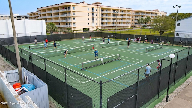 view of sport court with fence