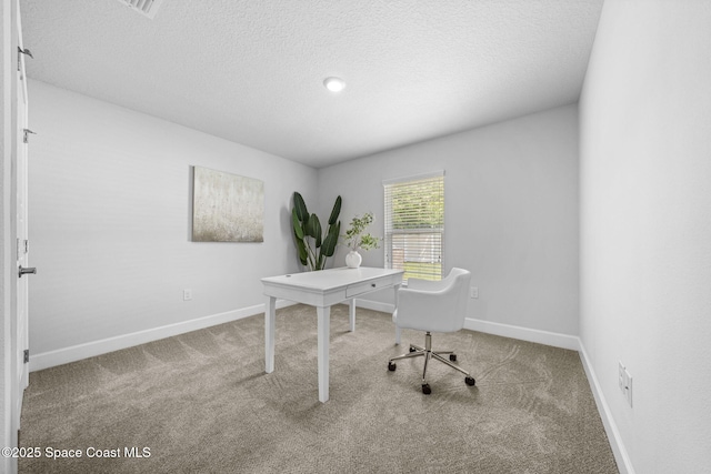 office space with light colored carpet and a textured ceiling