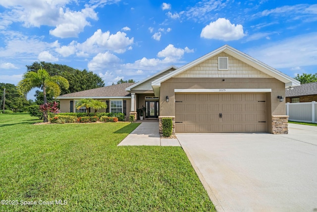 single story home featuring a garage and a front yard