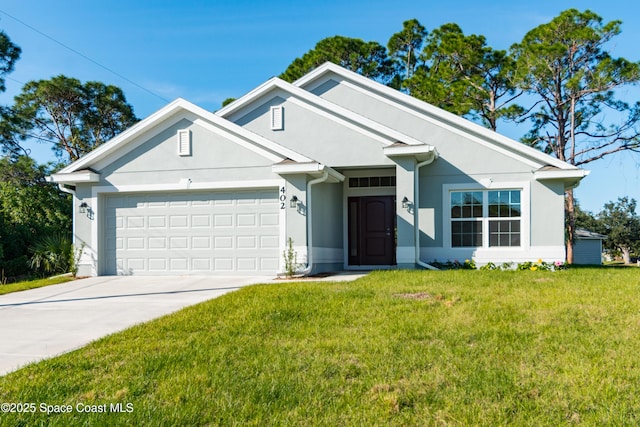 view of front of house with a garage and a front lawn