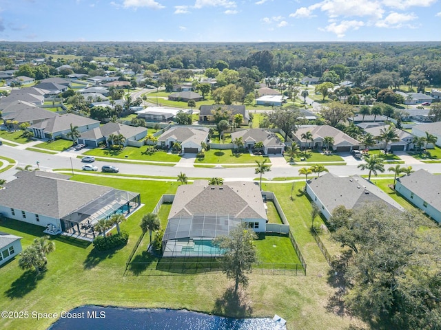 birds eye view of property with a residential view and a water view