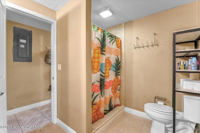 bathroom featuring a stall shower, electric panel, toilet, and tile patterned floors