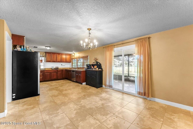 kitchen with stainless steel appliances, light countertops, hanging light fixtures, an inviting chandelier, and baseboards