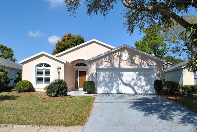 single story home featuring a garage, a front yard, concrete driveway, and stucco siding