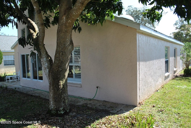 view of property exterior with stucco siding